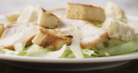 Closeup   of fresh simple caesar salad with chicken