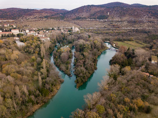 Fototapeta premium The Timavo River (Il fiume Timavo, Timava, Timav) is a two-kilometre stream in the Province of Trieste. It has four sources near San Giovanni (Štivan) near Duino (Devin)