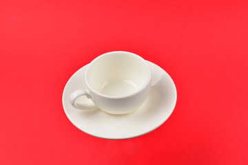 Empty cup on a red background