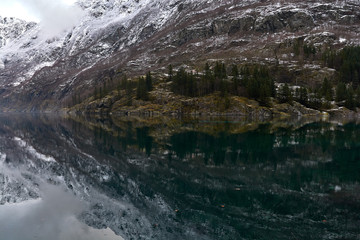 Fototapeta na wymiar Nærøy fjord in Norway. Landscape of mountains and transparent waters. Spectacular reflections. Dream voyages