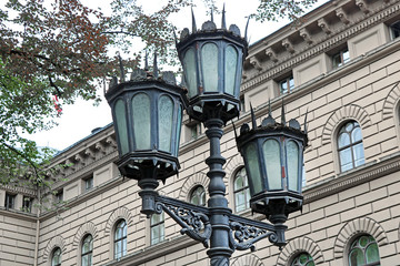 Lantern near main building of the Saeima - parliament of the Republic of Latvia in Riga Old City at...