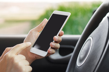 Women using smartphone in the car