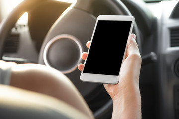 Women using smartphone in the car