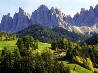 Fototapeta premium Beautiful view of idyllic mountain scenery in The Dolomites, Santa Maddalena village and Odle Mountains. South Tyrol, Italy