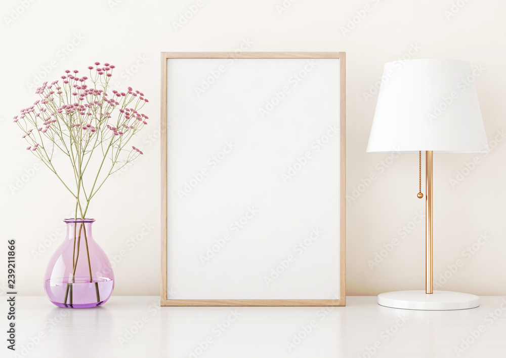 Poster home interior poster mock up with vertical frame on table, flowers in vase and lamp on warm white wa