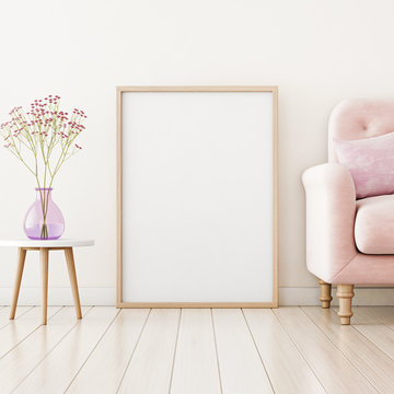 Poster mockup with vertical frame standing on floor in living room interior with pink sofa and flowers in vase. 3D rendering.
