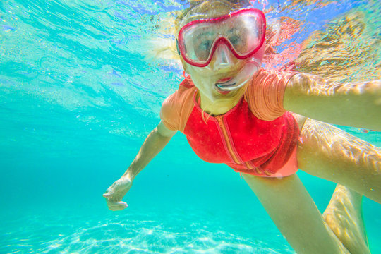 Happy woman snorkeling underwater. Selfie portrait. Travel lifestyle, watersport activity. Greens Pool, William Bay NP. Snorkel swims in a natural pool of Denmark coast, Western Australia.