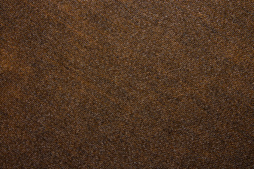 The texture of brown denim.Brown denim background.Brown tight jeans.