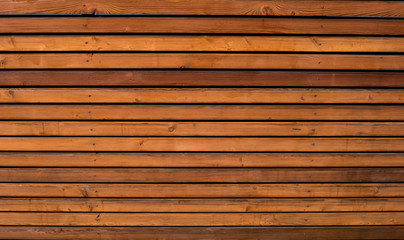 Wooden background with horizontal boards. Boards are fixed by nails