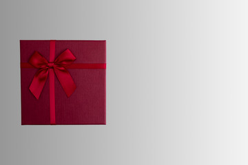 Red gift box on isolated red background