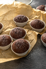 Sweet chocolate muffins with pieces of chocolate.