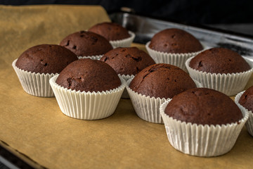 Sweet chocolate muffins with pieces of chocolate.