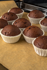 Sweet chocolate muffins with pieces of chocolate.