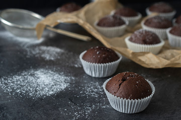 Sweet chocolate muffins with pieces of chocolate.