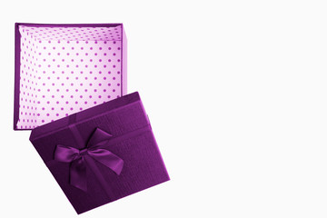 Lilac gift box with ribbon on isolated on white background