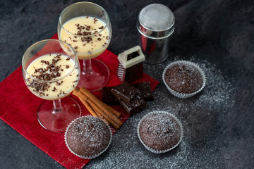 Fototapeta na wymiar Irish cream coffee liqueur and chocolate muffins, homemade festive Christmas alcoholic drink.