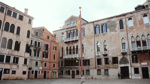 Flag Of The Republic Of Venice Among Old Buildings. 