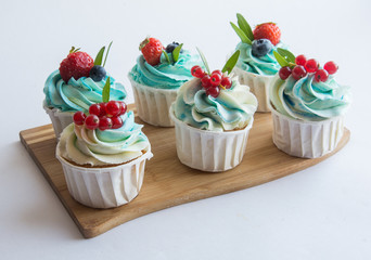cakes with blueberries and red currant
