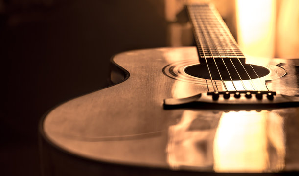 acoustic guitar close-up on a beautiful colored background