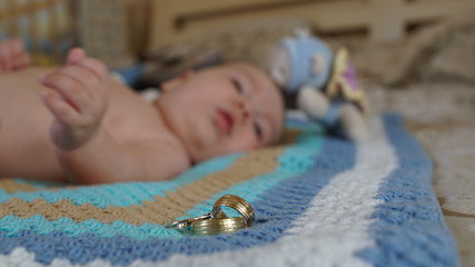 Three rings on the background of the cute litle boy