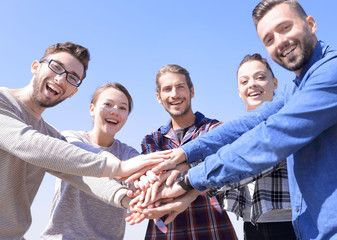 concept of teamwork. business people joined hands