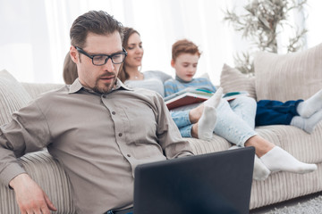 young man using laptop in his house