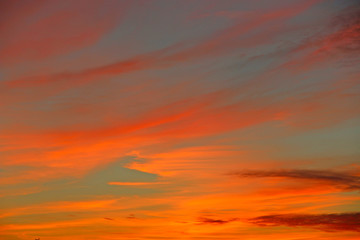 Orange sunset before night. Twilight with bright sunset. Evening landscape