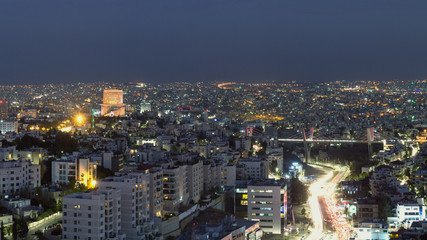 Obraz premium Abdoun bridge and famous 5 star hotel in Amman city at night - Aerial shot for Abdoun area and abdoun bridge