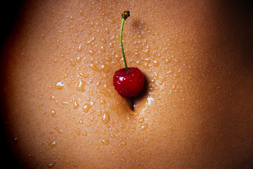 Wet navel close-up. Women Health. Young juicy berry on a sexy female body. The human sweat. Sports training and diet. Nutritionist and trainer. Vintage, women - 239224657