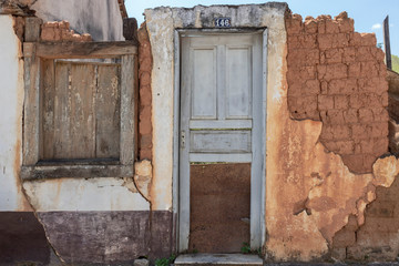old wooden door in stone wall