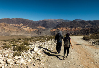 Couple walking around the desert mountains