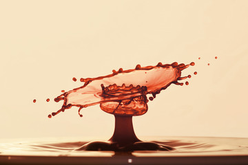 red abstract waterdrop sculpture created by multiple colliding drops