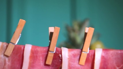 Dry meat hangs on a rope at catering. Celebrations Catering slider shoot