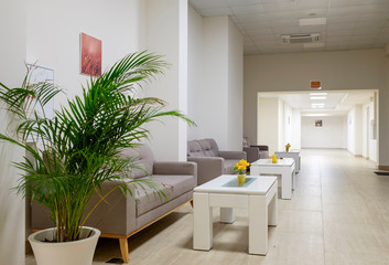 Long corridor with sofas and tables 1