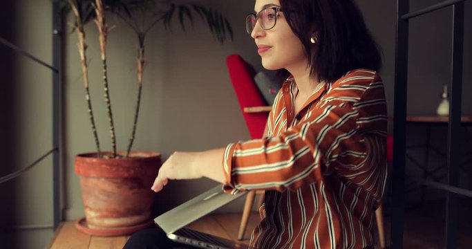 Businesswoman wear glasses in office, work on laptop and think about new ideas, close laptop and go away. Girl using laptop for work, copy space
