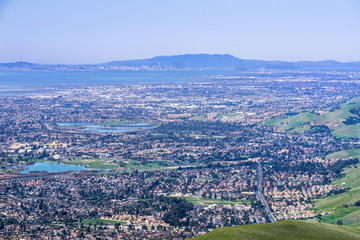 Aerial view of Fremont and other cities of east San Francisco bay; San Francisco and the bay bridge...