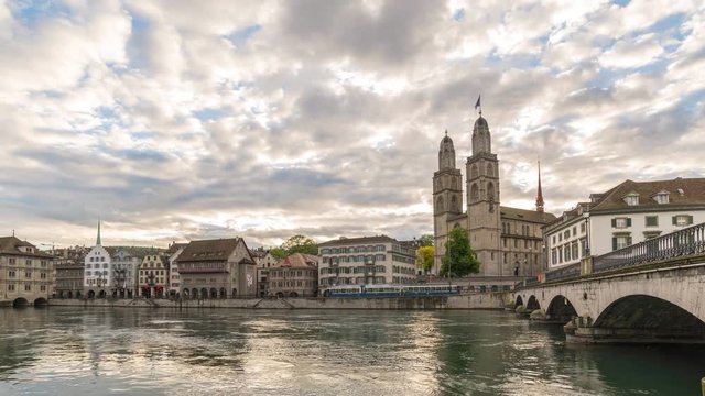 Zurich Switzerland time lapse 4K, city skyline sunrise timelapse at Limmat River with Grossmunster