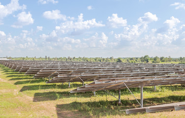 Fototapeta na wymiar Row of back side view photovoltaics solar panels in solar power station alternative energy from the sun