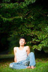 Asian male model poses for pictures on the street