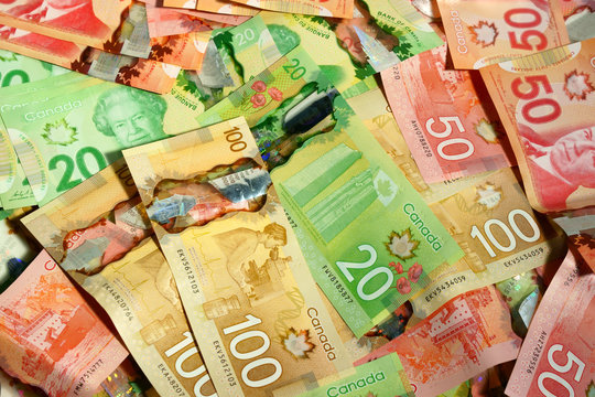 Canadian money filling the frame.