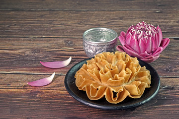 Thai food / Thai snacks: Crispy lotus Blossom Cookie (or Knanom Dok Jog / Dok Jok)  One of most famous Thai snacks. Copy space.