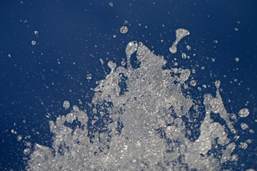 the fountain beats up against the sky