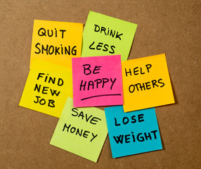 New Year resolutions or popular Goals and colorful sticky post its memo notes on cork board
