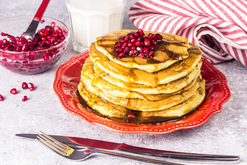 Healthy winter breakfast,homemade classic american pancakes with fresh pomegranate
