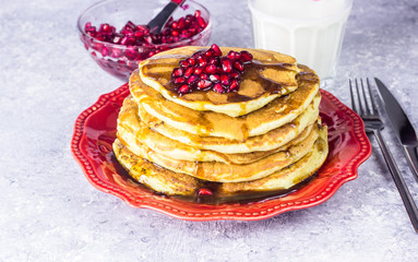 Healthy winter breakfast,homemade classic american pancakes with fresh pomegranate