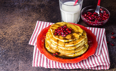 Healthy winter breakfast,homemade classic american pancakes with fresh pomegranate