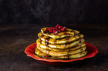 Healthy winter breakfast,homemade classic american pancakes with fresh pomegranate