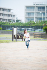 Asian female model poses for pictures on the street