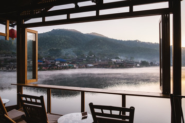 Mountain Mist and riverside view from the wooden window and chair of Little Home at Ruk Thai in Mae...