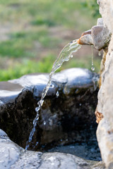 Water spring with stone channel in Tbilisi, Georgia